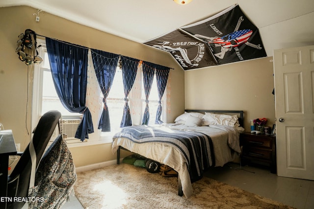 bedroom with lofted ceiling