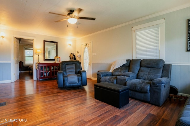 living room featuring ceiling fan, crown molding, and dark hardwood / wood-style floors