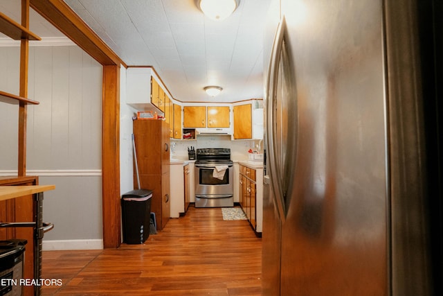 kitchen with light wood-type flooring and appliances with stainless steel finishes