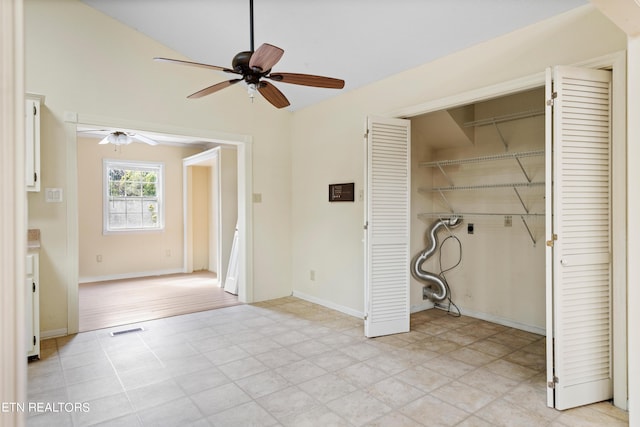 laundry area with ceiling fan