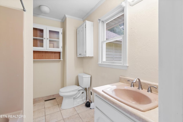 bathroom featuring ornamental molding, tile patterned floors, vanity, and toilet