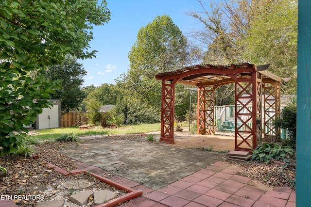 view of patio featuring an outbuilding