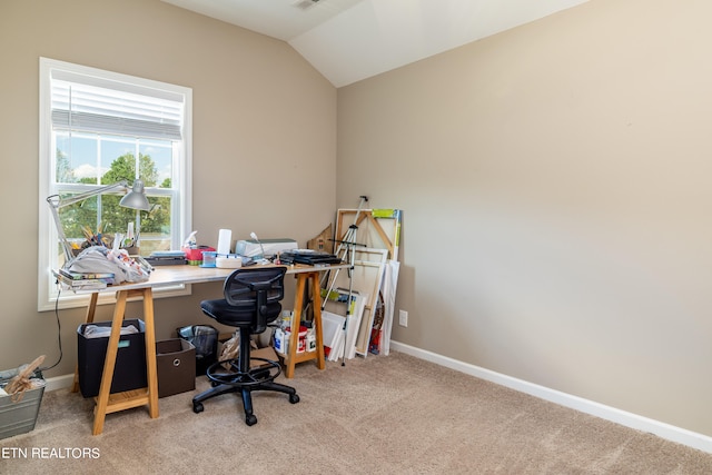 office space with carpet floors and vaulted ceiling