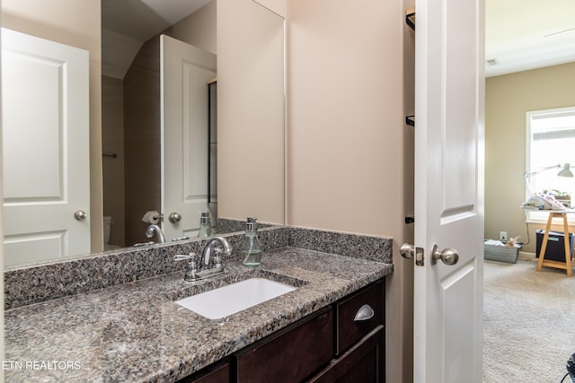 bathroom with vanity and toilet