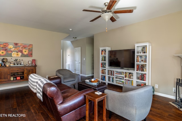 living room featuring ceiling fan and dark wood-type flooring