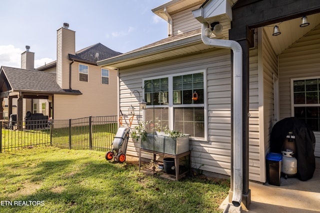 view of home's exterior with a yard