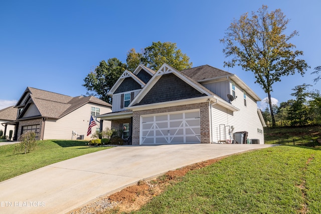 craftsman-style home with a front yard and a garage