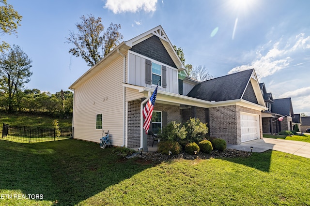 view of front of property with a garage and a front lawn