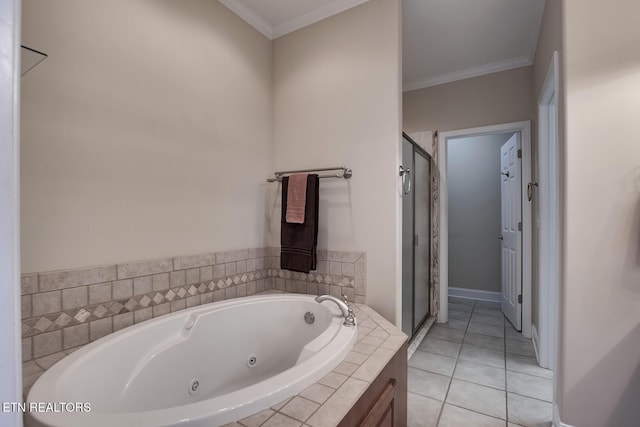 bathroom with ornamental molding, a tub with jets, a shower stall, and tile patterned floors