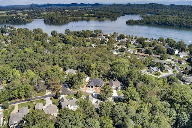 aerial view featuring a residential view, a water view, and a forest view