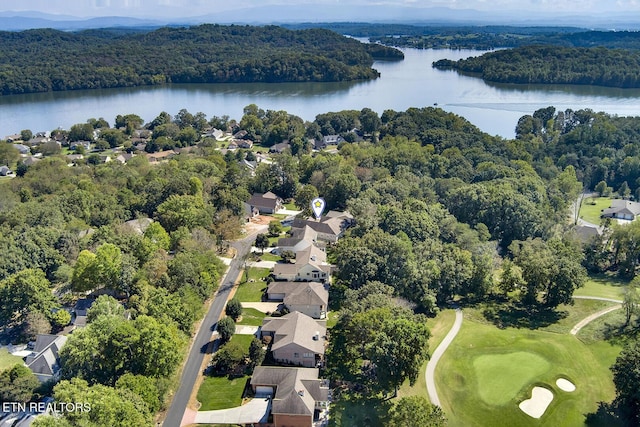 bird's eye view with a residential view, a water view, a view of trees, and golf course view