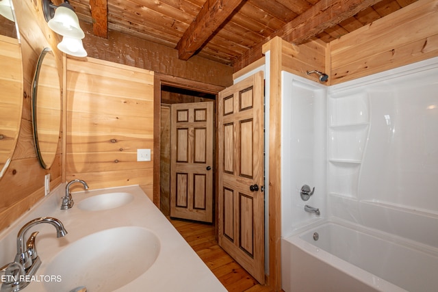 bathroom featuring wooden ceiling, beam ceiling, hardwood / wood-style floors, and bathtub / shower combination