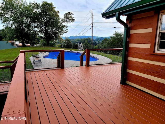 view of pool with a deck