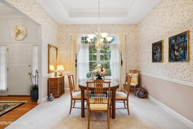 122 Vinita Ln, Loudon, TN 37774 - dining space with crown molding, wallpapered walls, an inviting chandelier, a raised ceiling, and light colored carpet