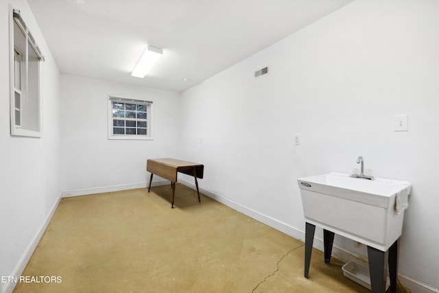122 Vinita Ln, Loudon, TN 37774 - interior space featuring concrete flooring, visible vents, and baseboards