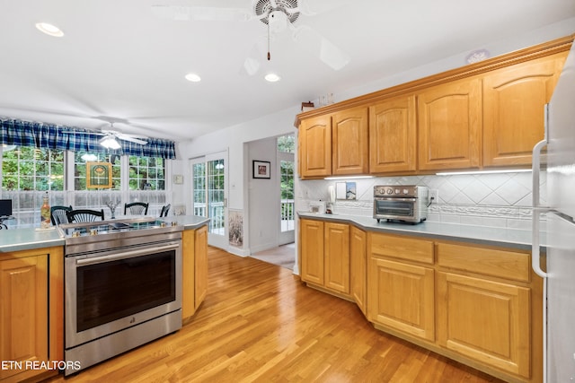 122 Vinita Ln, Loudon, TN 37774 - kitchen with a toaster, tasteful backsplash, light wood-type flooring, stainless steel range with electric stovetop, and ceiling fan