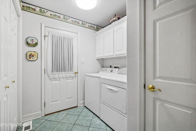 122 Vinita Ln, Loudon, TN 37774 - clothes washing area with visible vents, baseboards, independent washer and dryer, cabinet space, and light tile patterned floors