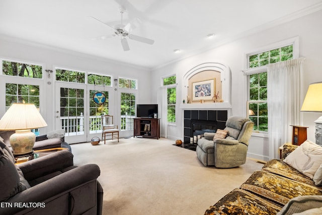 122 Vinita Ln, Loudon, TN 37774 - living room with a tile fireplace, carpet, a ceiling fan, ornamental molding, and baseboards