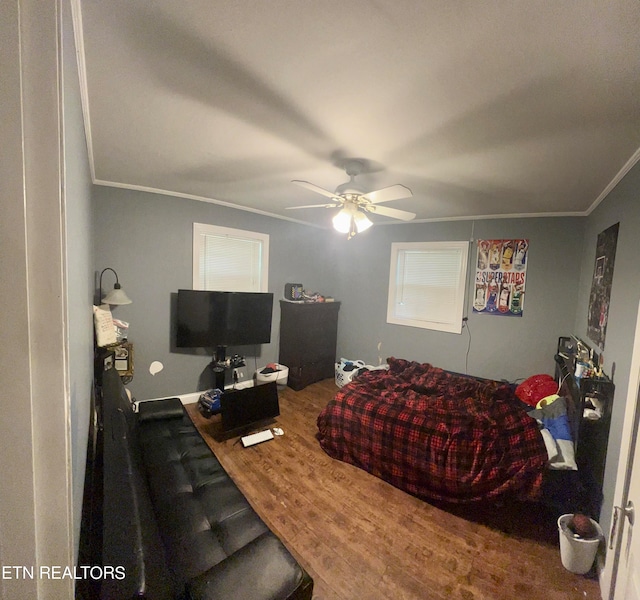 living room with ornamental molding, ceiling fan, and hardwood / wood-style flooring