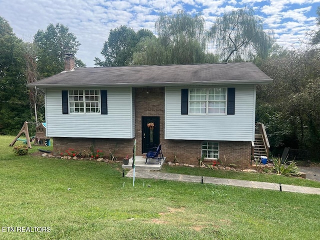 bi-level home with a front lawn