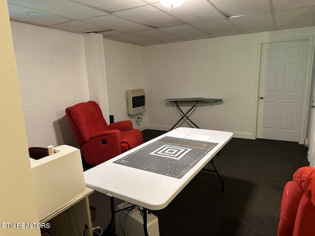 office space featuring heating unit and a paneled ceiling