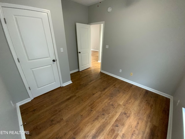 unfurnished bedroom featuring hardwood / wood-style floors