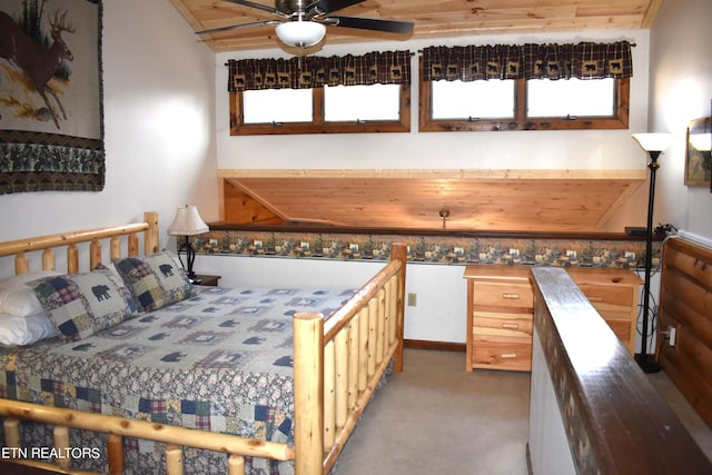 bedroom featuring wood ceiling, vaulted ceiling, ceiling fan, and light colored carpet