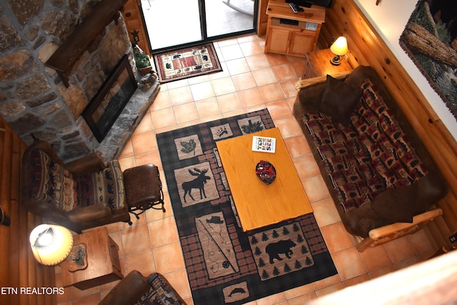 living room featuring a fireplace and tile patterned floors