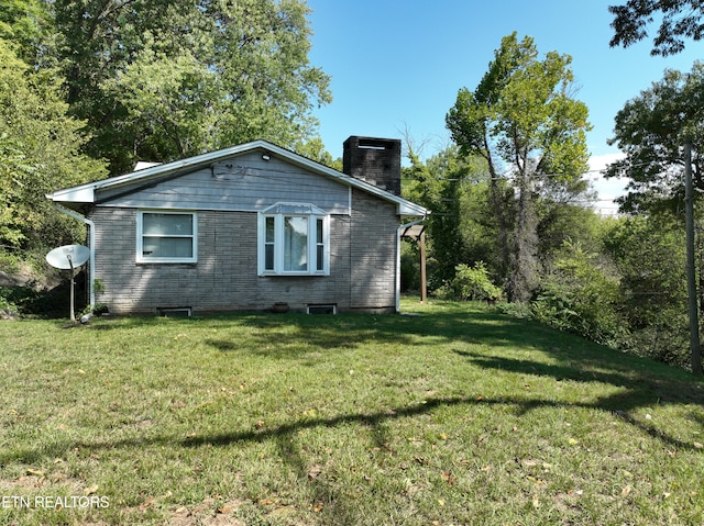 view of property exterior featuring a lawn and cooling unit