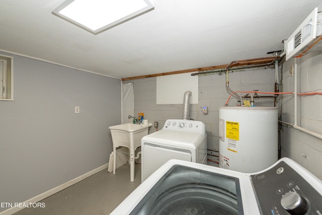 laundry area featuring washer and dryer and electric water heater