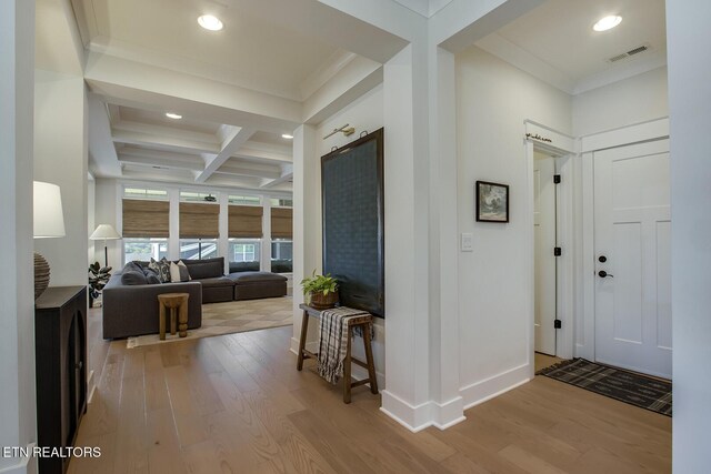 entryway with recessed lighting, visible vents, light wood-style flooring, and coffered ceiling
