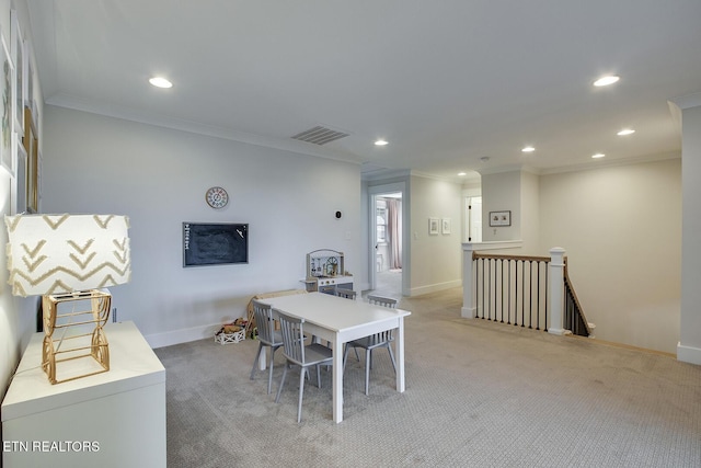 dining area featuring recessed lighting, ornamental molding, visible vents, and light carpet