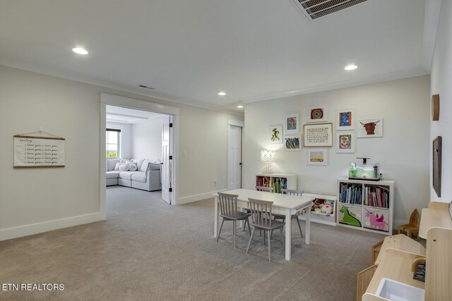 dining room with recessed lighting, baseboards, light colored carpet, and visible vents