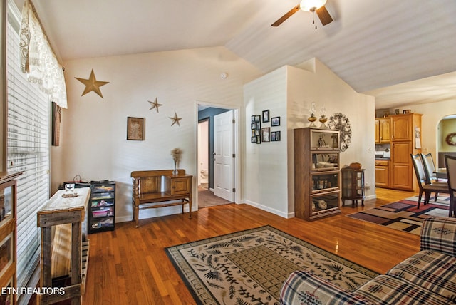 living room featuring lofted ceiling, ceiling fan, and hardwood / wood-style floors