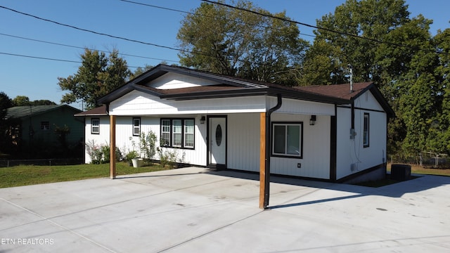 view of front of home with cooling unit and covered porch