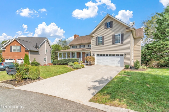 front facade featuring a front lawn and a garage