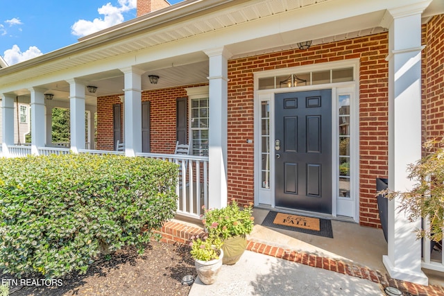 entrance to property with covered porch