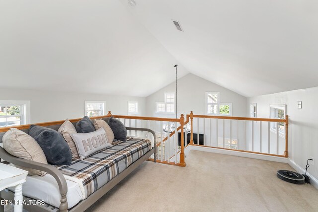 living area with light carpet and lofted ceiling