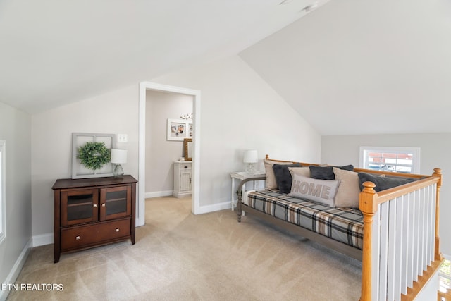 living area featuring light colored carpet and lofted ceiling