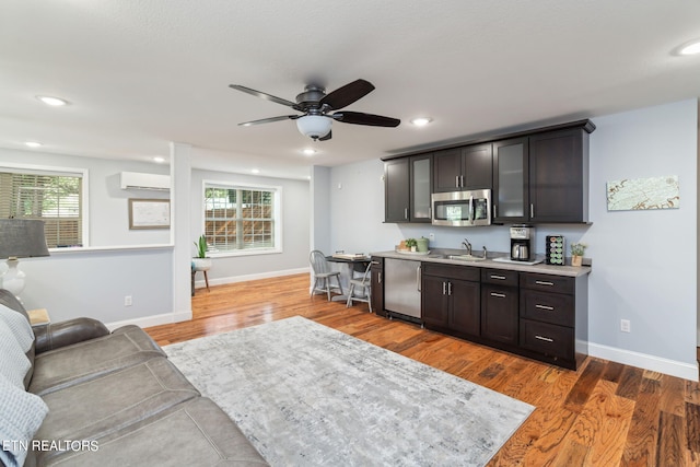 interior space featuring sink, appliances with stainless steel finishes, plenty of natural light, and dark hardwood / wood-style floors