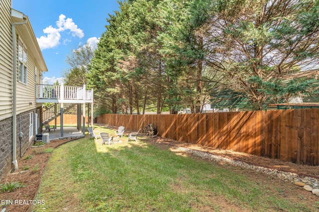 view of yard with a wooden deck