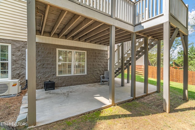 view of patio / terrace featuring ac unit and a wooden deck