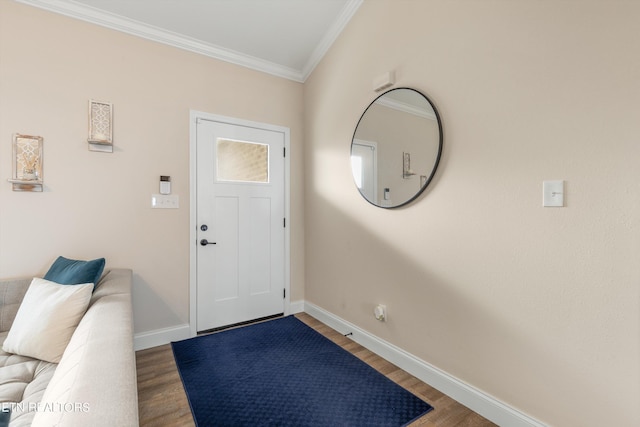 entryway with ornamental molding and hardwood / wood-style flooring