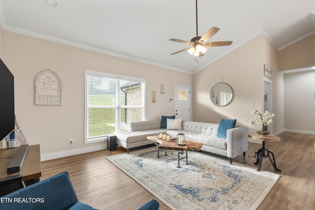 living room featuring ceiling fan, lofted ceiling, crown molding, and hardwood / wood-style floors