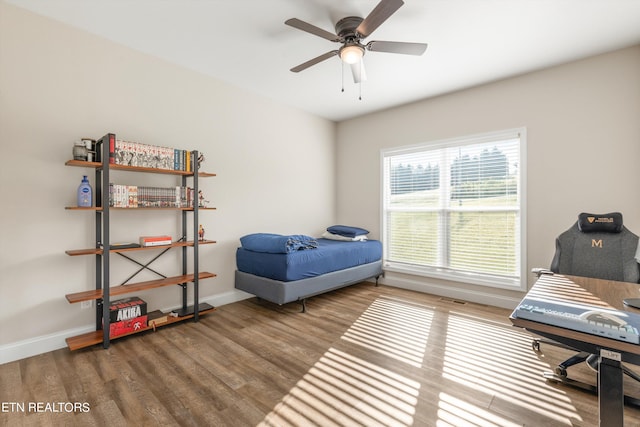 bedroom featuring ceiling fan and wood-type flooring