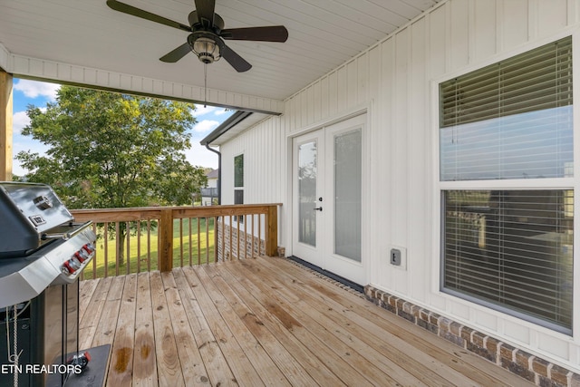 wooden terrace featuring ceiling fan, french doors, and a grill