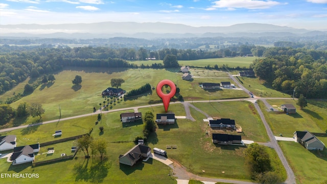 bird's eye view featuring a mountain view and a rural view