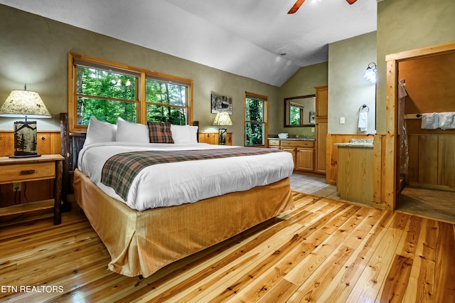 bedroom with lofted ceiling, ceiling fan, and light hardwood / wood-style flooring