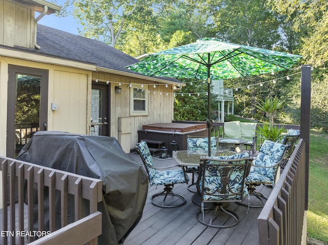 wooden terrace with a grill and a hot tub