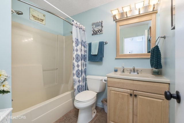 full bathroom with vanity, a textured ceiling, shower / bathtub combination with curtain, tile patterned flooring, and toilet